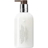 Поживний лосьйон для тіла «мандарин, боби тонка та тепла амбра» Molton Brown Neon Amber Body Lotion, 300 мл. - вигляд 2